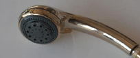 Adjustable handheld shower head with multiple spray positions in a sleek chrome finish.